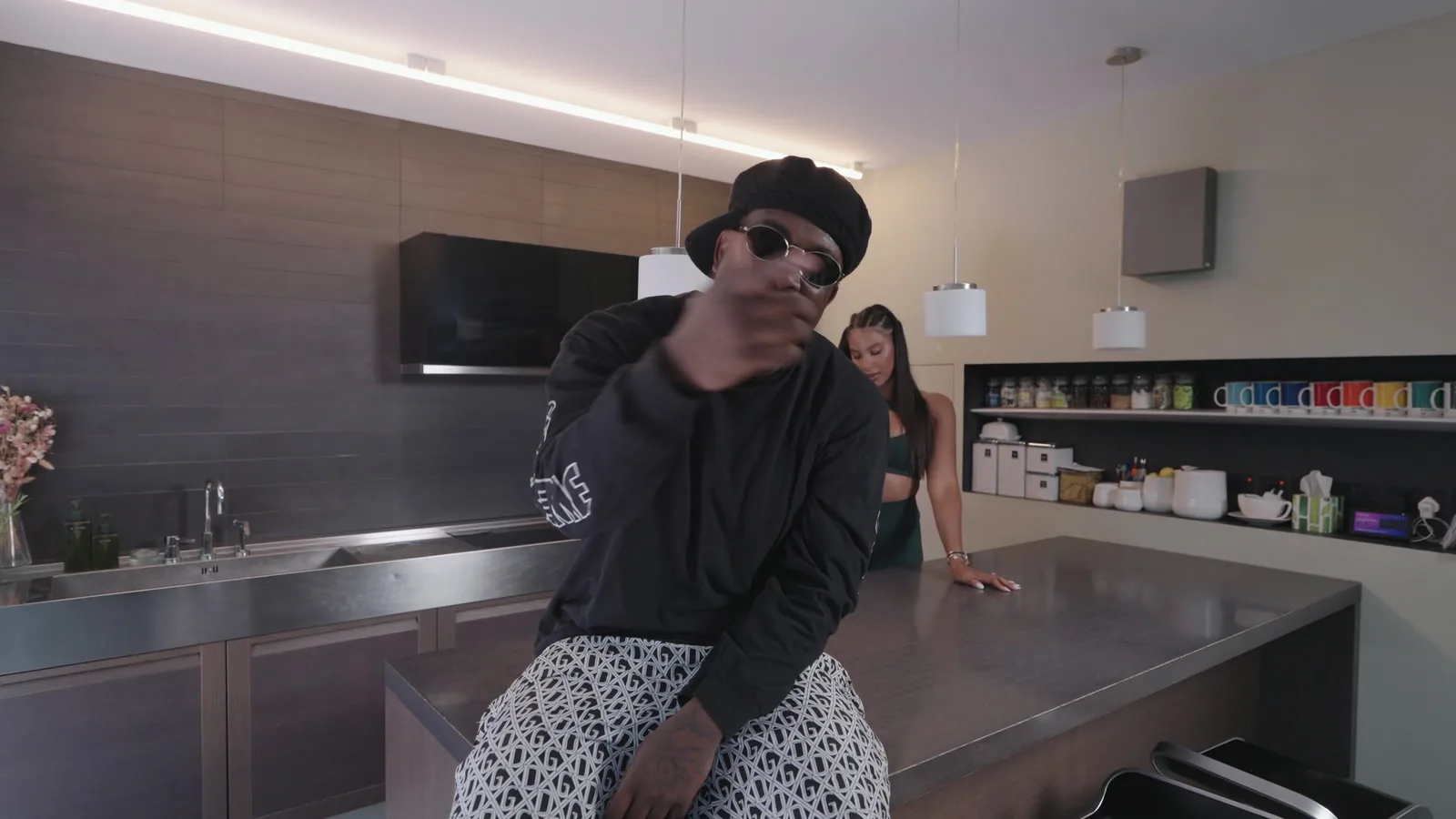 Kojo Funds performing in the Long Time official visualiser
